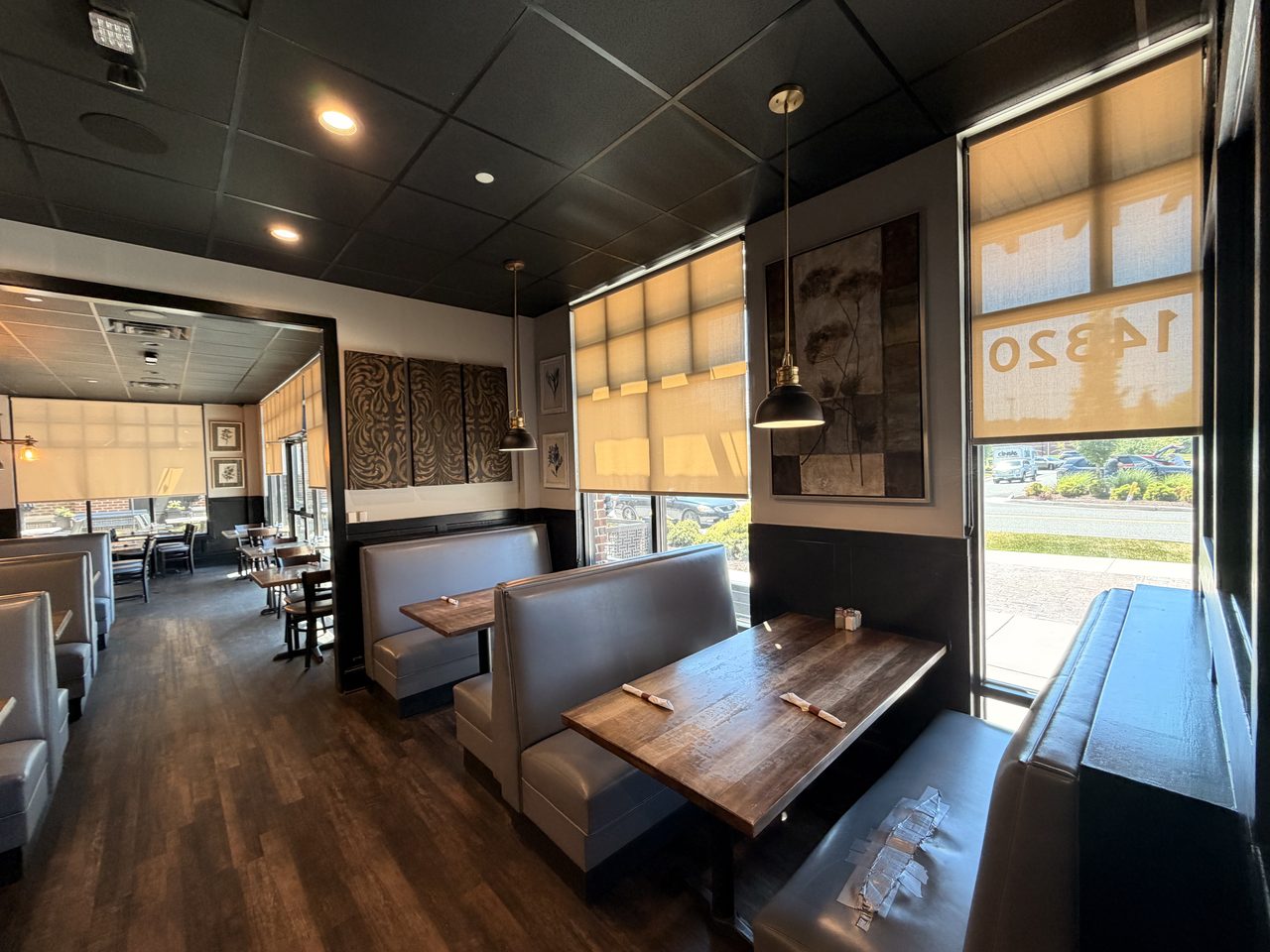 Warm booth seating against stone walls