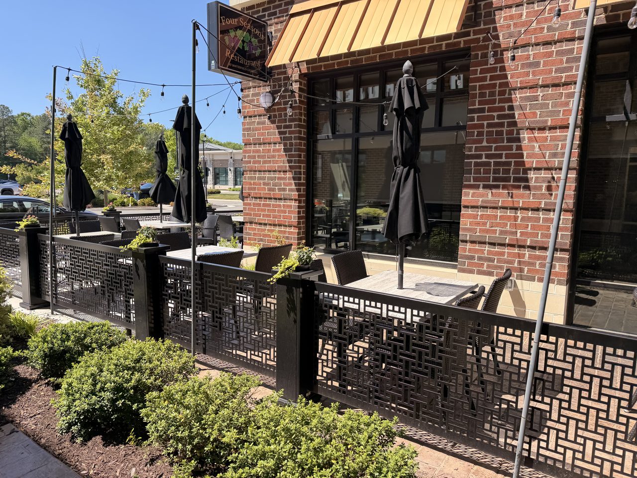 Outdoor patio with green awnings